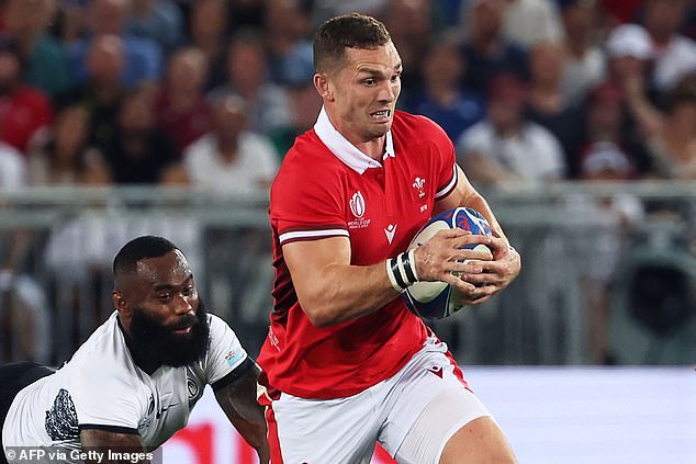 Wales outside center George North runs to avoid Fiji's inside center Semi Radradra during the 2023 Rugby World Cup in France