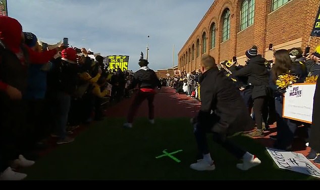 The fan's attempt was impressive, but narrowly missed the posts outside Michigan's stadium