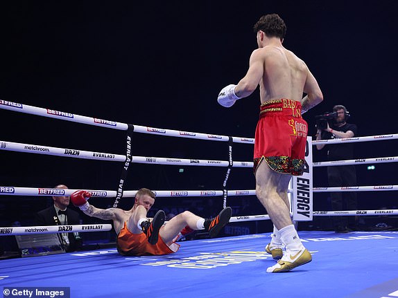 DUBLIN, IRELAND – NOVEMBER 25: John Cooney knocks down Liam Gaynor during their Celtic Super Featherweight Title fight at the 3Arena Dublin on November 25, 2023 in Dublin, Ireland.  (Photo by Mark Robinson/Getty Images)