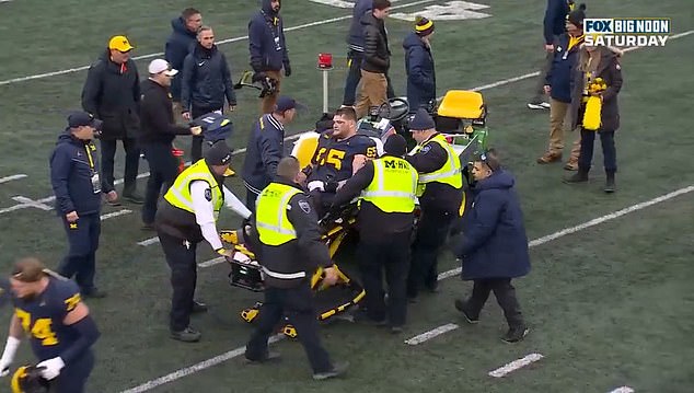 Zinter was able to sit up on a stretcher and received a standing ovation from Michigan fans