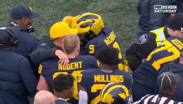 Michigan quarterback JJ McCarthy was pictured hugging Zinter's parents on the sidelines