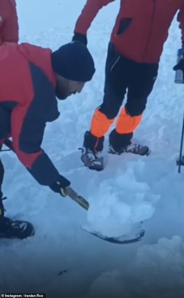 Images from the Iranian Red Crescent show rescuers working to locate bodies and free any survivors from the snow