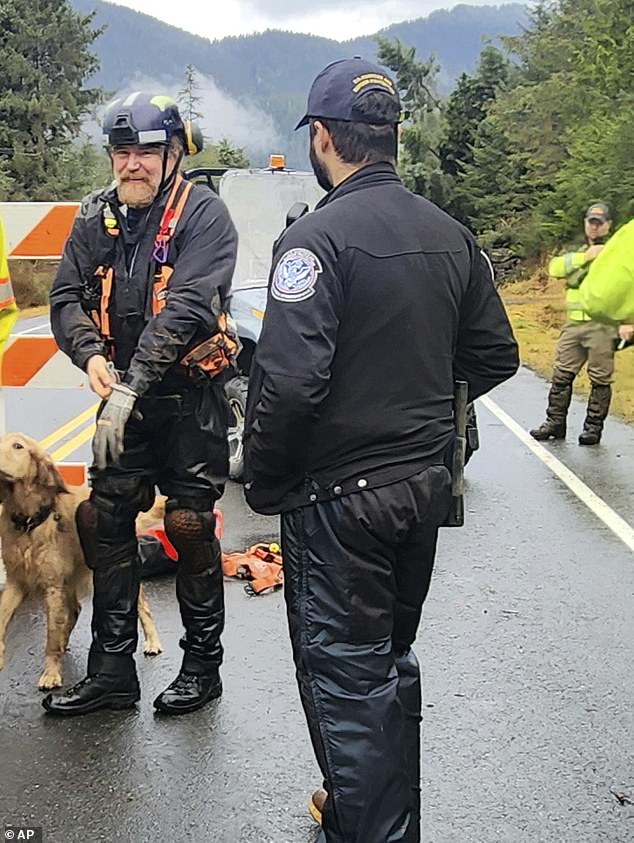 Pictured: Ground teams, including search and rescue dogs, are actively working to search areas that state geologists say are safe to enter Wednesday after a massive landslide at mile 11 of the Zimovia Highway.
