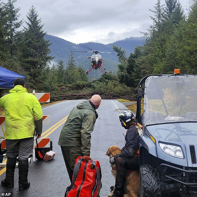 Pictured: A helicopter arrives near kilometer 11 of the Zimovia Highway