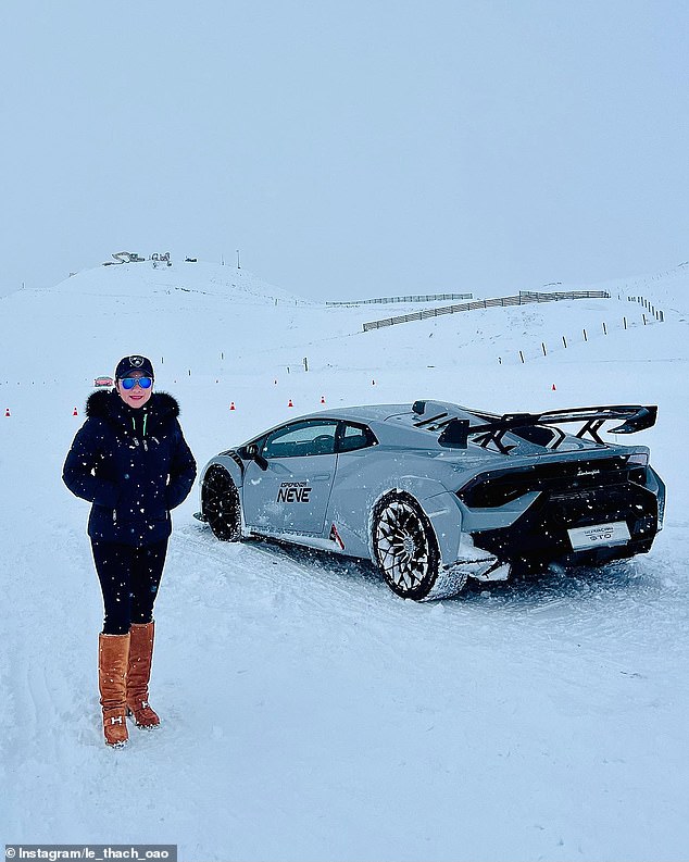 Ms. Thach poses with a catr during a trip to the snow