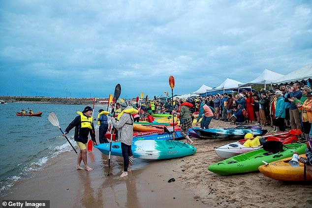 During the 30-hour protest outside the world's largest coal port, activists rowed out onto the water on kayaks, surfboards and pontoons