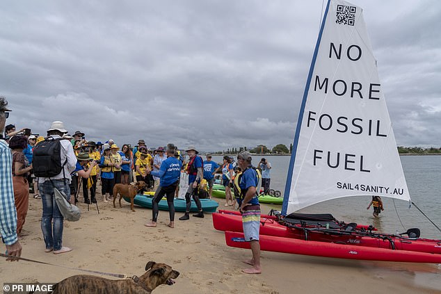 Hundreds of protesters enter Newcastle Harbor to prevent coal export ships from entering or leaving