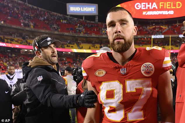 Kelce is looking for his brother Jason as Philadelphia Eagles head coach Nick Sirianni pets him