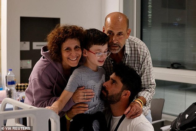 Nine-year-old Ohad Monder is reunited with his father, brother and family member