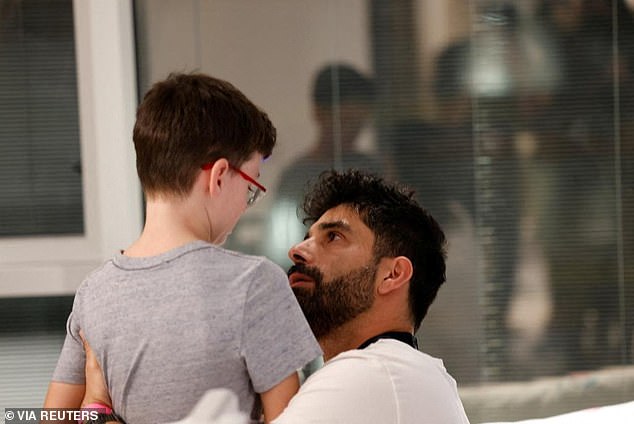 Ohad and his brother embrace after the youth's release from Gaza