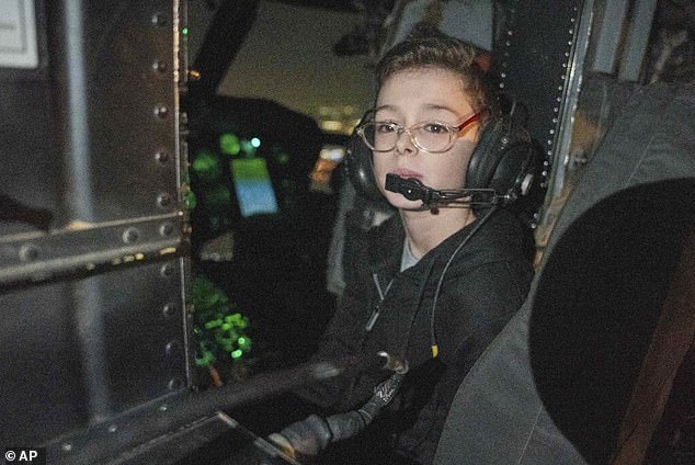 Ohad sits in an Israeli military helicopter shortly after arriving in Israel on Friday, November 24