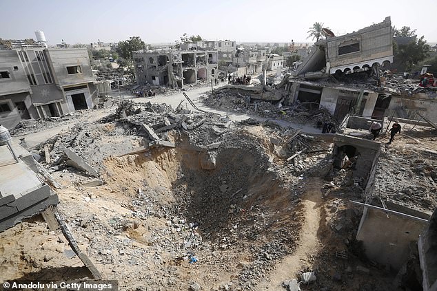 An aerial view of the wreckage of residential areas following Israeli attacks during the third day of the humanitarian pause in Khan Yunis