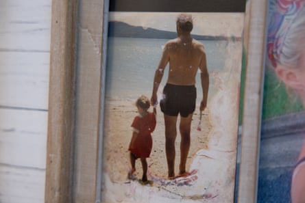 Heather as a toddler on an Auckland beach with her grandfather