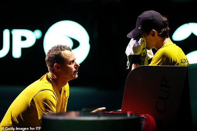 Alex de Minaur (pictured right, with Hewitt) was blown off the field by the in-form Jannik Sinner, who won their match 6-3, 6-0