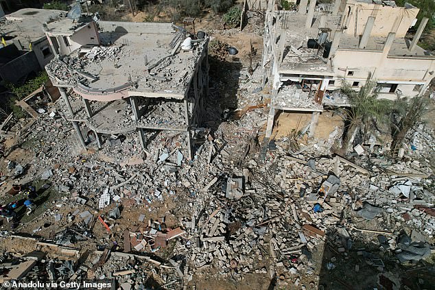 An aerial view of heavily damaged buildings following Israeli attacks during the third day of the humanitarian pause in Khan Yunis, Gaza