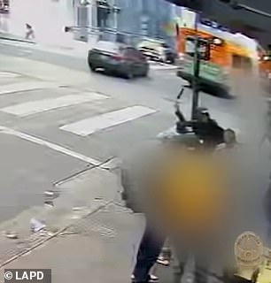 Security cameras captured Duong waving wildly at a passerby on 6th Street in LA