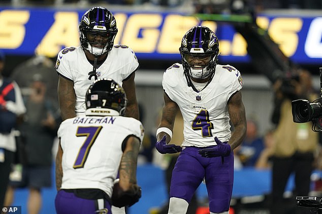 Flowers celebrates his TD catch with wide receiver Rashod Bateman in the second quarter