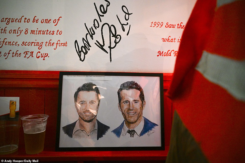 The pub features photos dedicated to Rob McElhenney and Ryan Reynolds, who took over Wrexham AFC in 2021