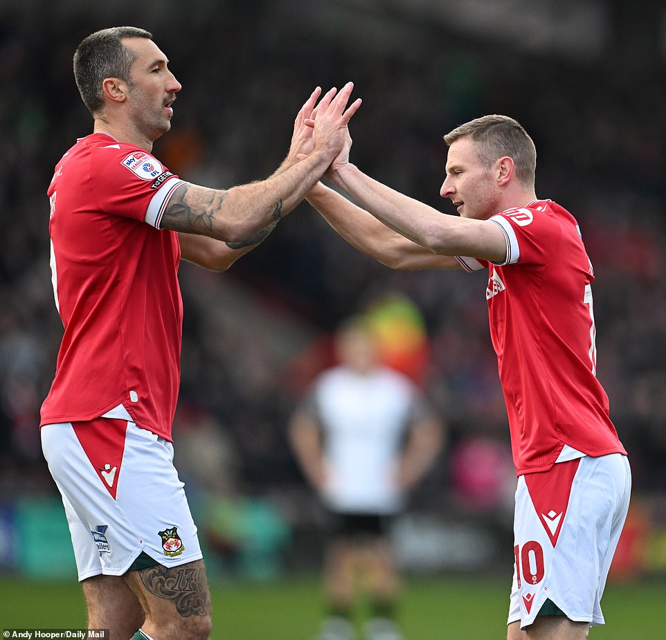 Mullin celebrated with teammate and fellow Wrexham AFC striker Ollie Palmer during the emphatic home win