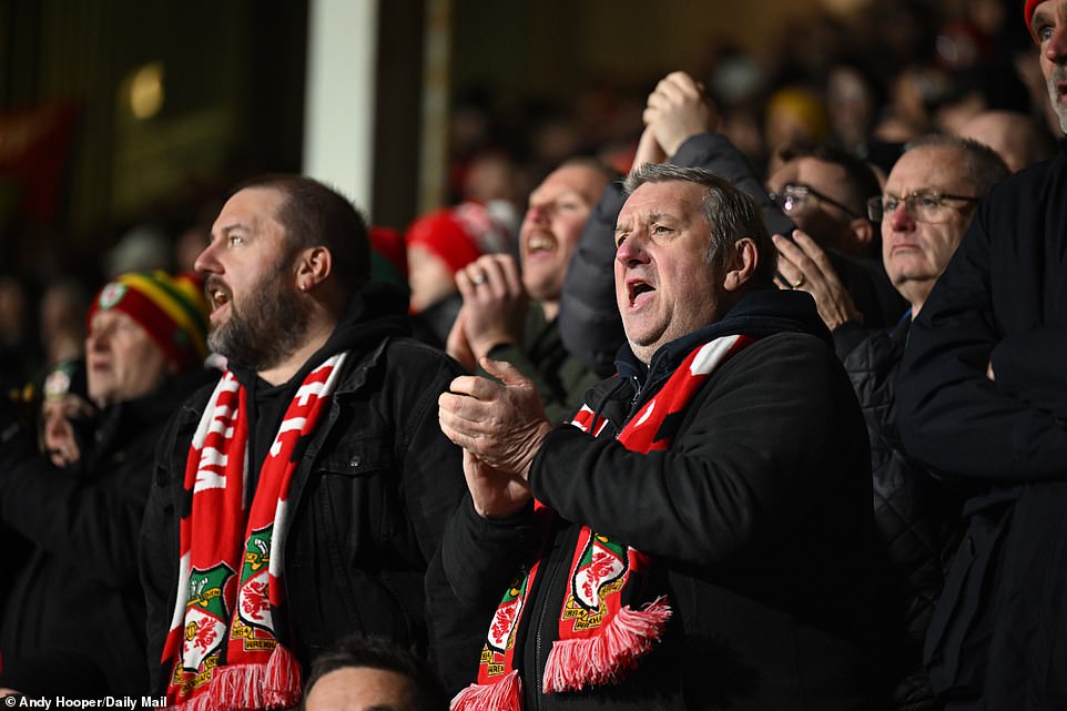 Fans proudly wore their red and white Wrexham scarves as they cheered alongside their side for a 6-0 win