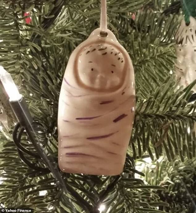 While a baby Jesus ornament wrapped in a blanket didn't look as cute as it should - it looks like a hairu thumb