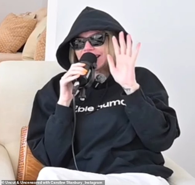 Caroline tried to cover herself up while talking about her facelift on her podcast on Wednesday