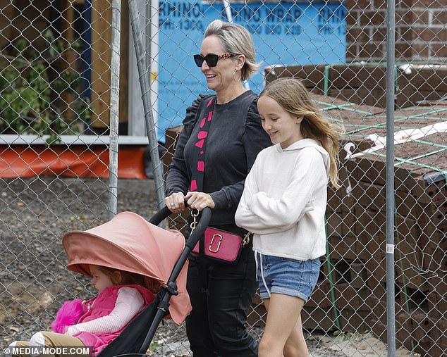 She opted for a chic black outfit for the luxurious meal, including a long-sleeved ruffled top and dark jeans.  Fifi carried a designer crossbody bag with a red and black design