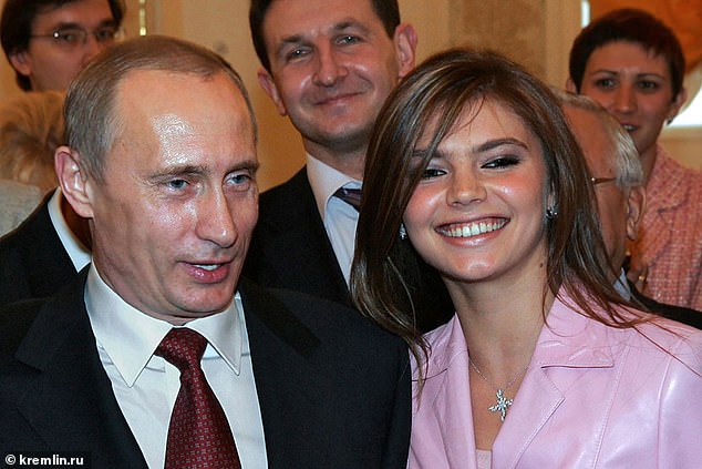 Alina Kabaeva and Vladimir Putin at an event in the Kremlin in the 2000s