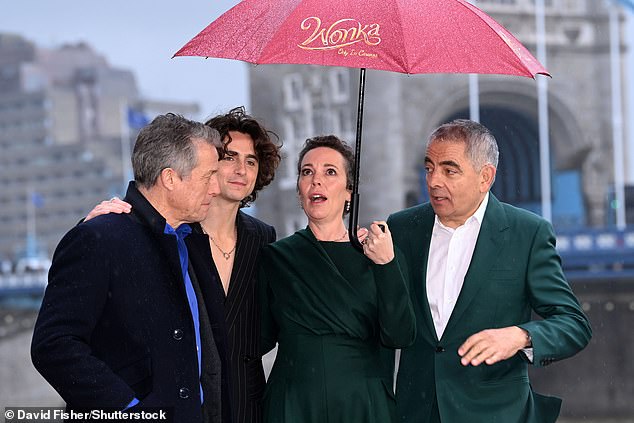 Good times!  The stars were forced to battle the heavy rain during the photocall