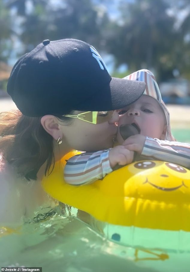 Doting mum: Jessie also shared some sweet snaps of little Sky relaxing in his inflatable pool as the two enjoyed a dip together