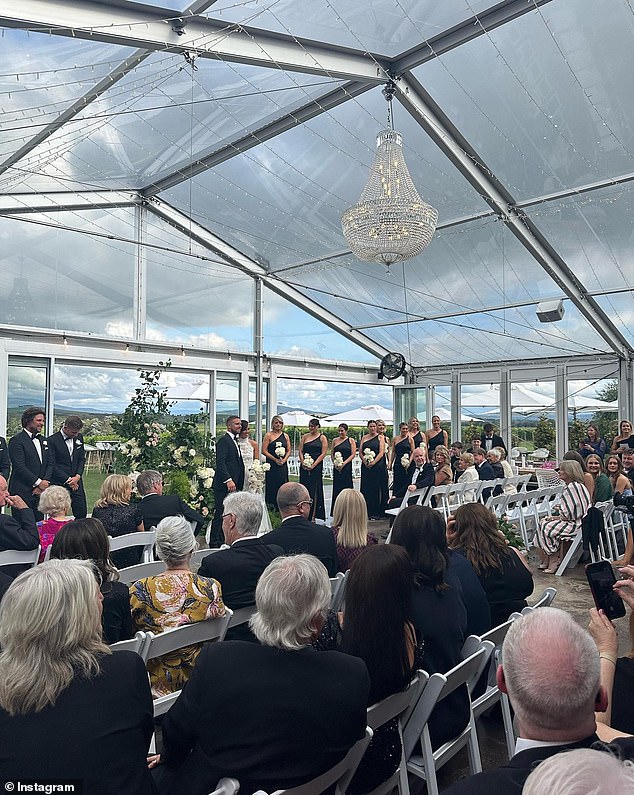 A chandelier decorated the tent where they got married