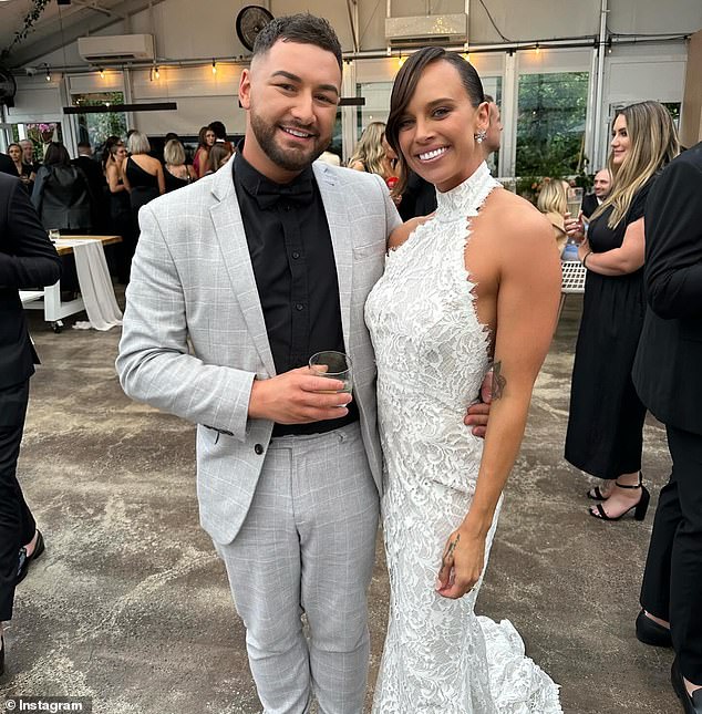 Bonnie, 29, stunned in a sleeveless halterneck lace dress by Australian couture designer Jason Grech.  Taking a photo with a friend