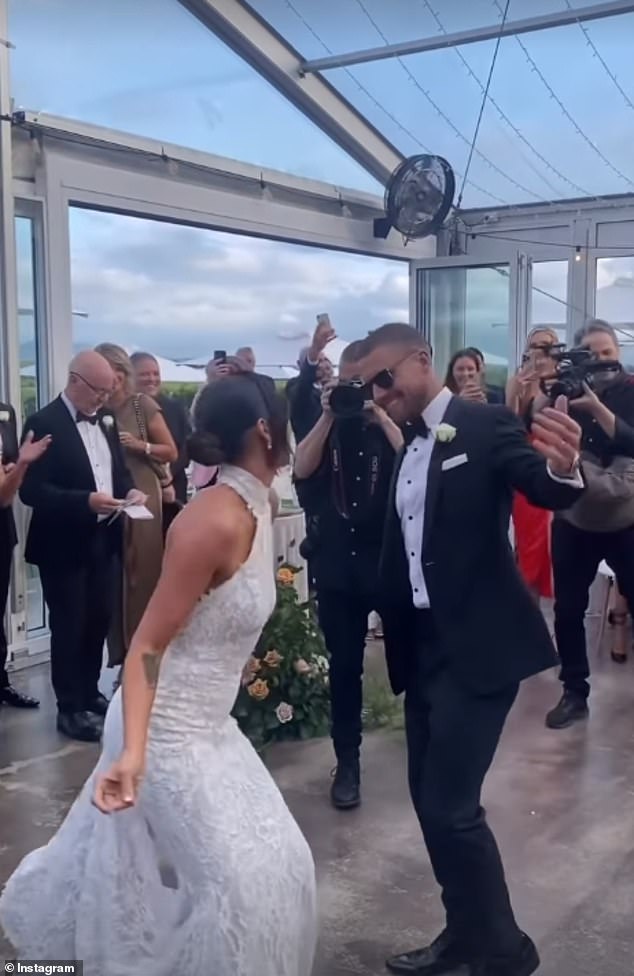 The groom kept it classic in a black tuxedo with a white shirt and bow tie, along with leather dress shoes