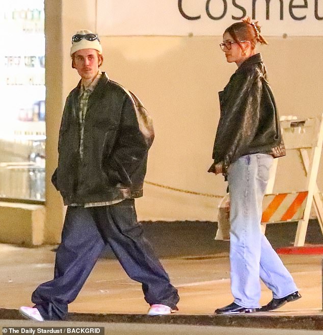 Casual outing: The lovebirds - who tied the knot in 2018 - were spotted walking along a quiet sidewalk before crossing a street as the couple headed to their next destination