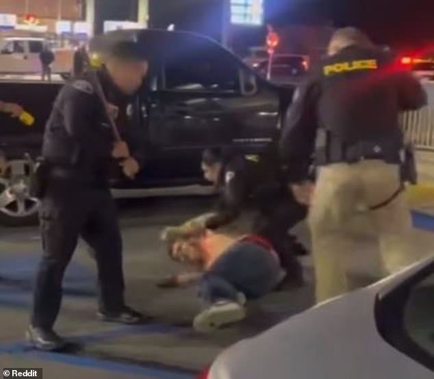 The male customer tried to get back up, but the officers held him down and the officer with the baton began hitting the male customer's legs as he screamed in pain.