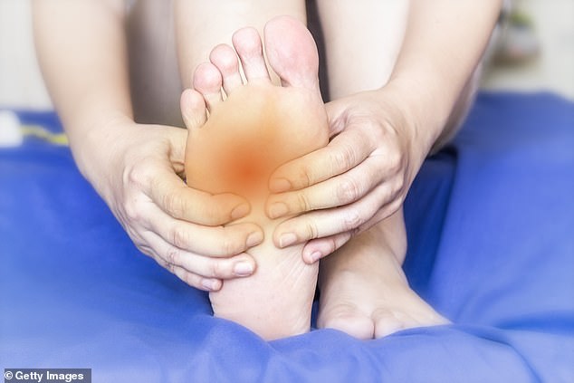 Foot cramps occur when a muscle contracts involuntarily – this can be for a number of reasons including dehydration, low potassium levels, nerve damage, even tight shoes (stock photo)