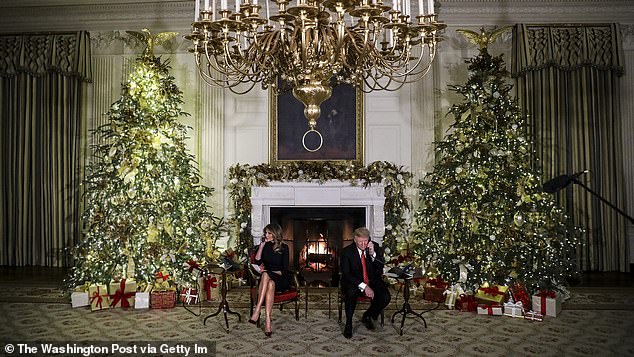 President Donald Trump and first lady Melania Trump speak on the phone to children as they follow Santa Claus with the North American Aerospace Defense Command, NORAD, in 2018. Trump famously asked a seven-year-old child: 