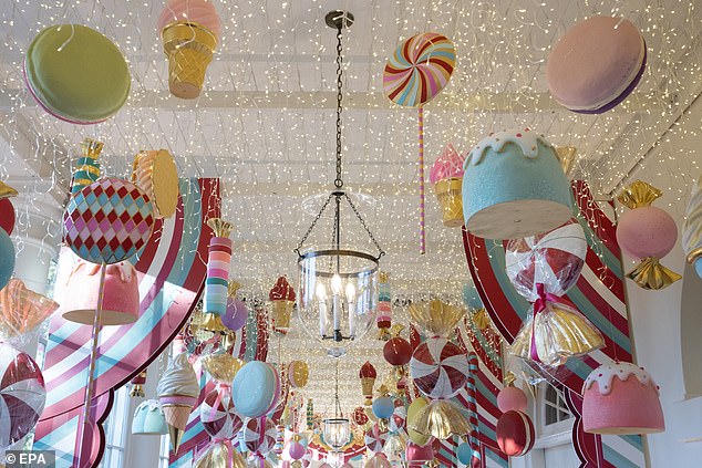 Christmas decorations hang from the ceiling in parts of the White House