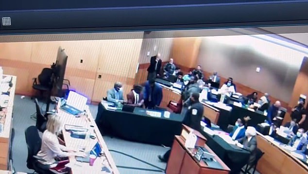 The moment in January Young Thug was handed a Percocet pill by his co-defendant during a pre-trial hearing in Fulton County Court