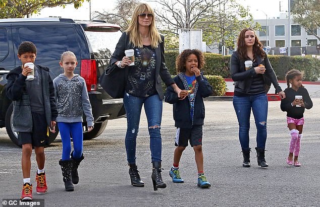 Proud mother: Klum went on to say that despite going through a divorce, she was committed to ensuring the well-being of her children;  she is seen with her children in 2014