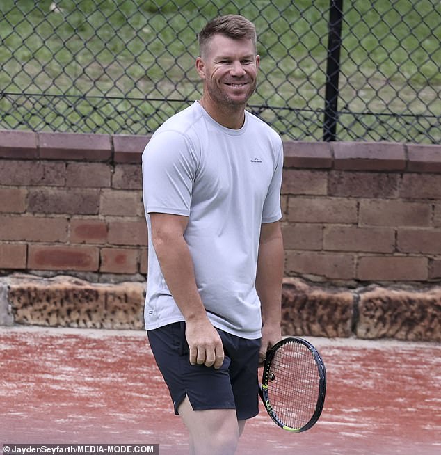 He happily showed off his athletic skills when he picked up a tennis racket to play a match with his girls