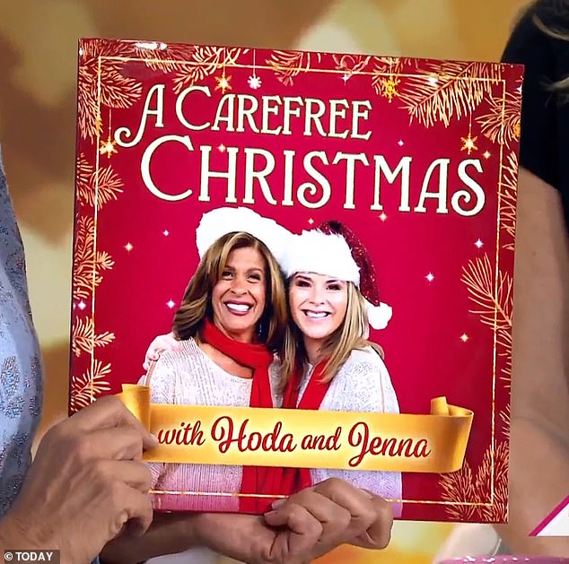 The duo unveiled the cover art for the song, titled A Carefree Christmas, which featured the pair standing side by side in red scarves and Santa hats.