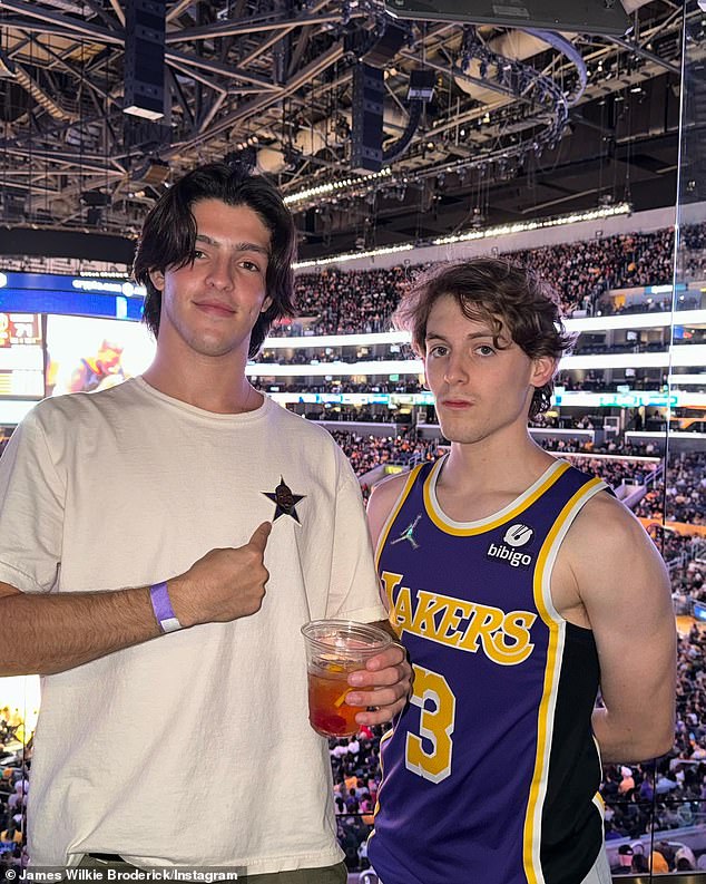 Basketball fan: James – who works as a sales associate at Reiss when he's in Manhattan – also showed off his biceps in an LA Lakers jersey as he cheered for the home team at the Crypto.com Arena