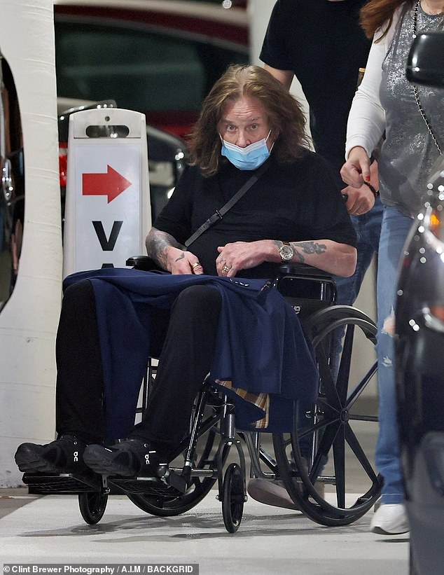 Struggle: Ozzy, who was diagnosed with Parkinson's disease in 2003, spoke candidly about his health before revealing doctors had found a tumor in his spine (pictured earlier this month)