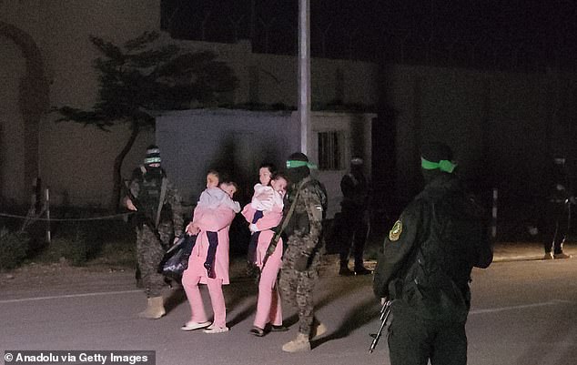 A yet-unidentified hostage was seen leaving Hamas prison in a wheelchair, while several others were seen wearing bright pink clothing yesterday.