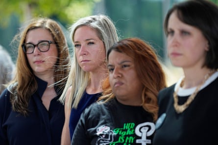 Amanda Zurawski, second from left, who developed sepsis and nearly died after being denied an abortion when her waters broke at 18 weeks, and Samantha Casiano, second from right, who was forced to carry out a non-viable pregnancy and deliver a baby birthers who died four hours after birth stand with their attorneys outside the Travis County Courthouse, July 19, 2023, in Austin.