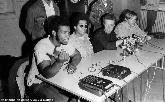 Fred Hampton, left, chairman of the Black Panthers, speaks during a press conference with the Young Lords on October 10, 1969 at Holy Covenant United Methodist Church in Chicago.  With Hampton are, from left, Pablo "Yoruba" Guzman, a young gentleman from New York;  Jose "Cha Cha" Jimenez, founder of the Young Lords of Chicago;  and Mike Klonsky, a spokesman for Students for a Democratic Society