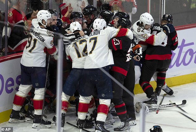 Players from the Ottawa Senators and Florida Panthers brawl during the third period