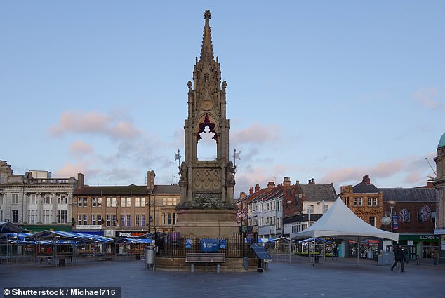 The bars were sold at a city center market on Saturday as 'five for one £1 mystery chocolate bars'.  Pictured, stock image of Mansfield Market Place