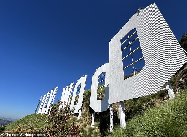 Strictly off limits to the general public, Thomas is given special permission to climb to the Hollywood sign, where he takes the photo above